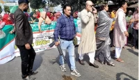 আওয়ামী লীগের মিছিলে প্রকাশ্যে অস্ত্র হাতে কে এই ব্যক্তি!